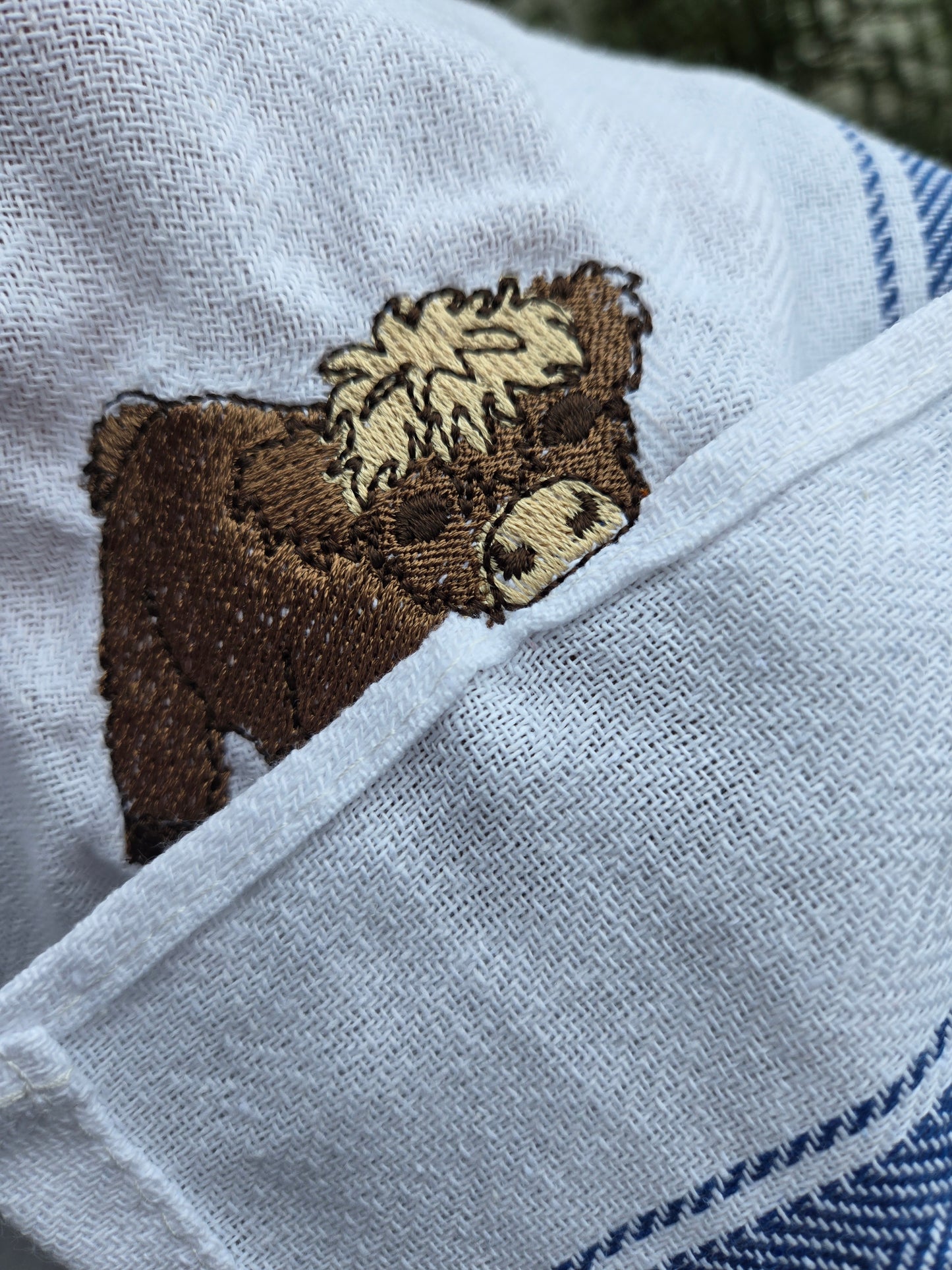 Cheeky Highland Cow Pet Thief embroidery design on white cotton blue striped tea towel NZ