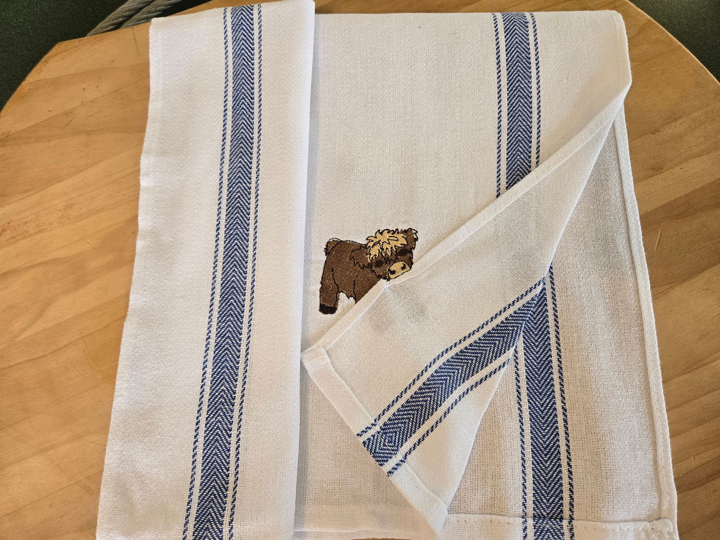 Cheeky Highland Cow Pet Thief embroidery design on white cotton striped tea towel NZ