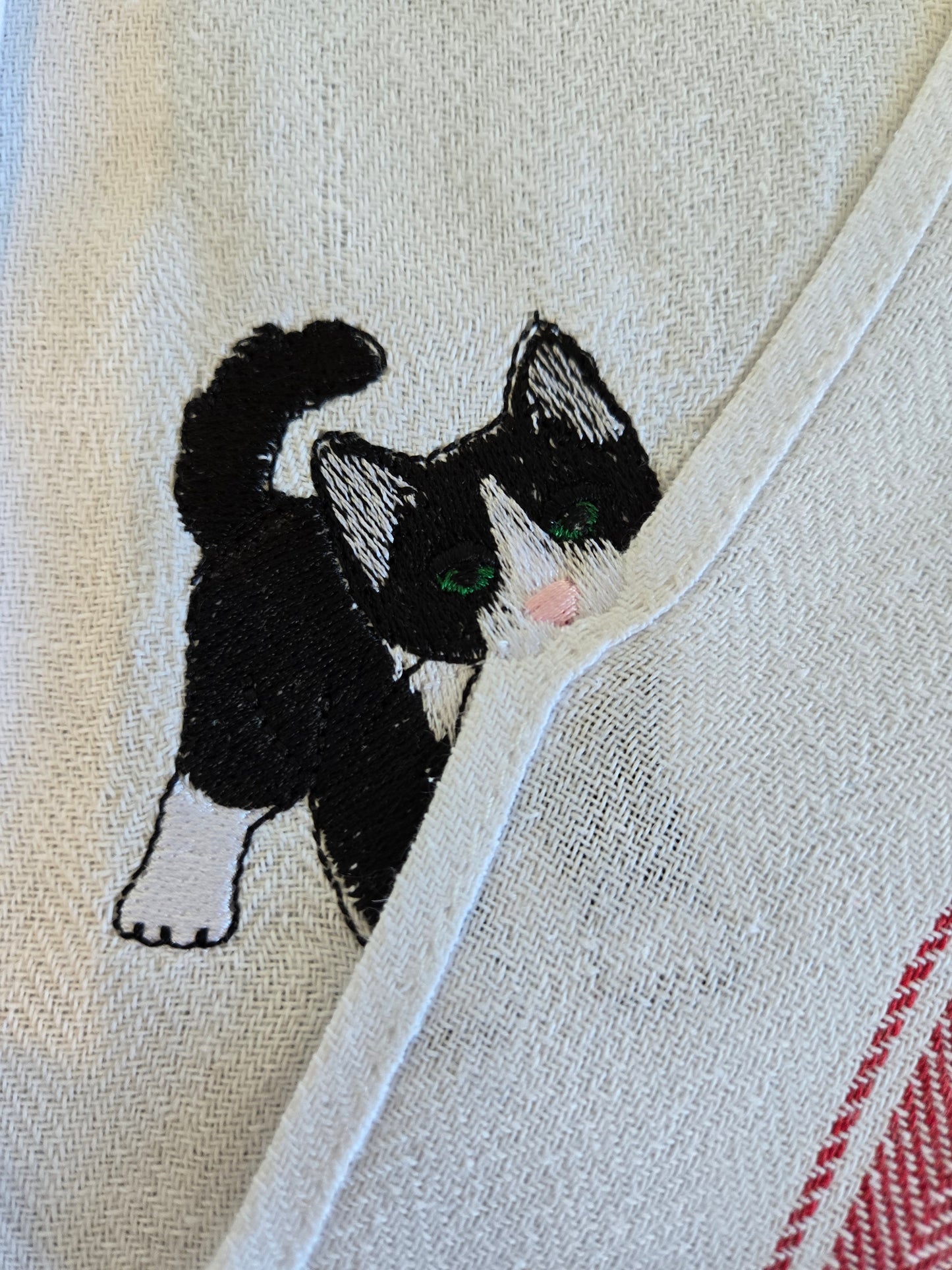 Cheeky playing cat pet thief embroidery design on white cotton striped tea towel NZ