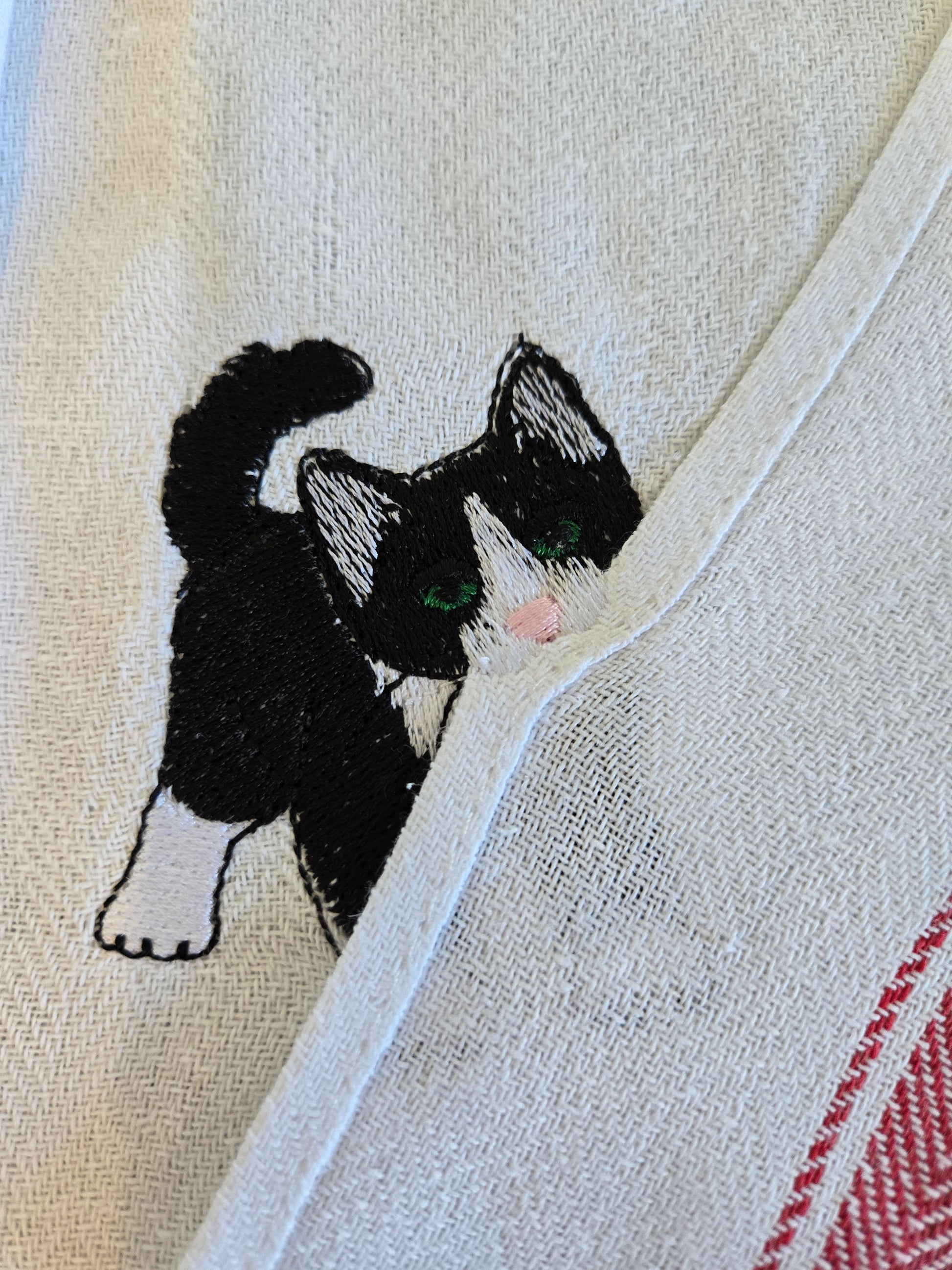 Cheeky playing cat pet thief embroidery design on white cotton striped tea towel NZ