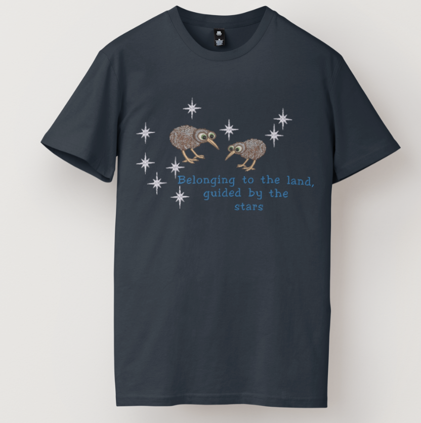 Embroidered Matariki star cluster design with two kiwi birds and the quote Belonging to the land, guided by the stars on a black t-shirt and hoodie.
