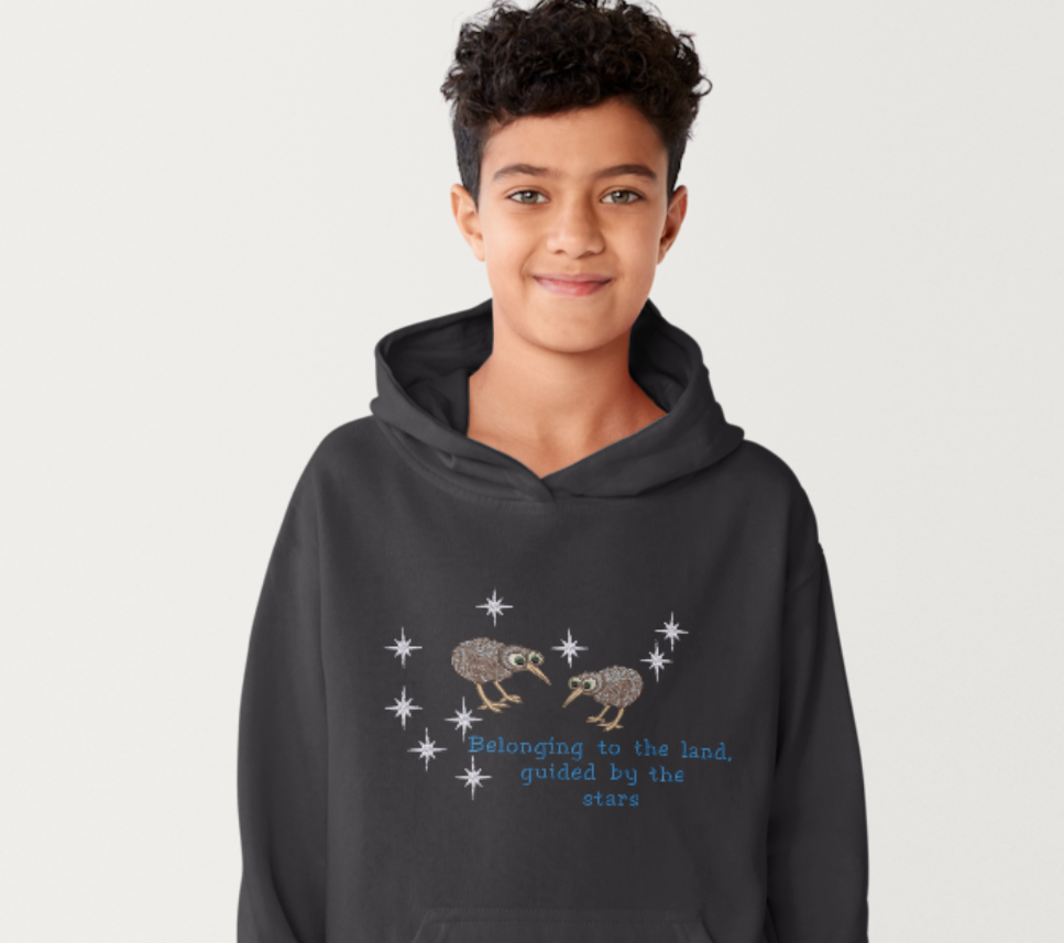 Embroidered Matariki star cluster design with two kiwi birds and the quote Belonging to the land, guided by the stars on a black t-shirt and hoodie.