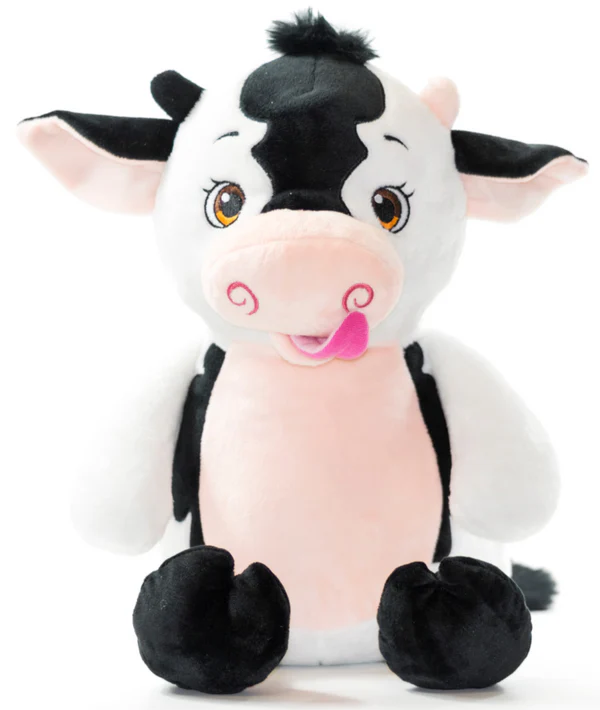 Plush cow toy with black and white pattern on a white background